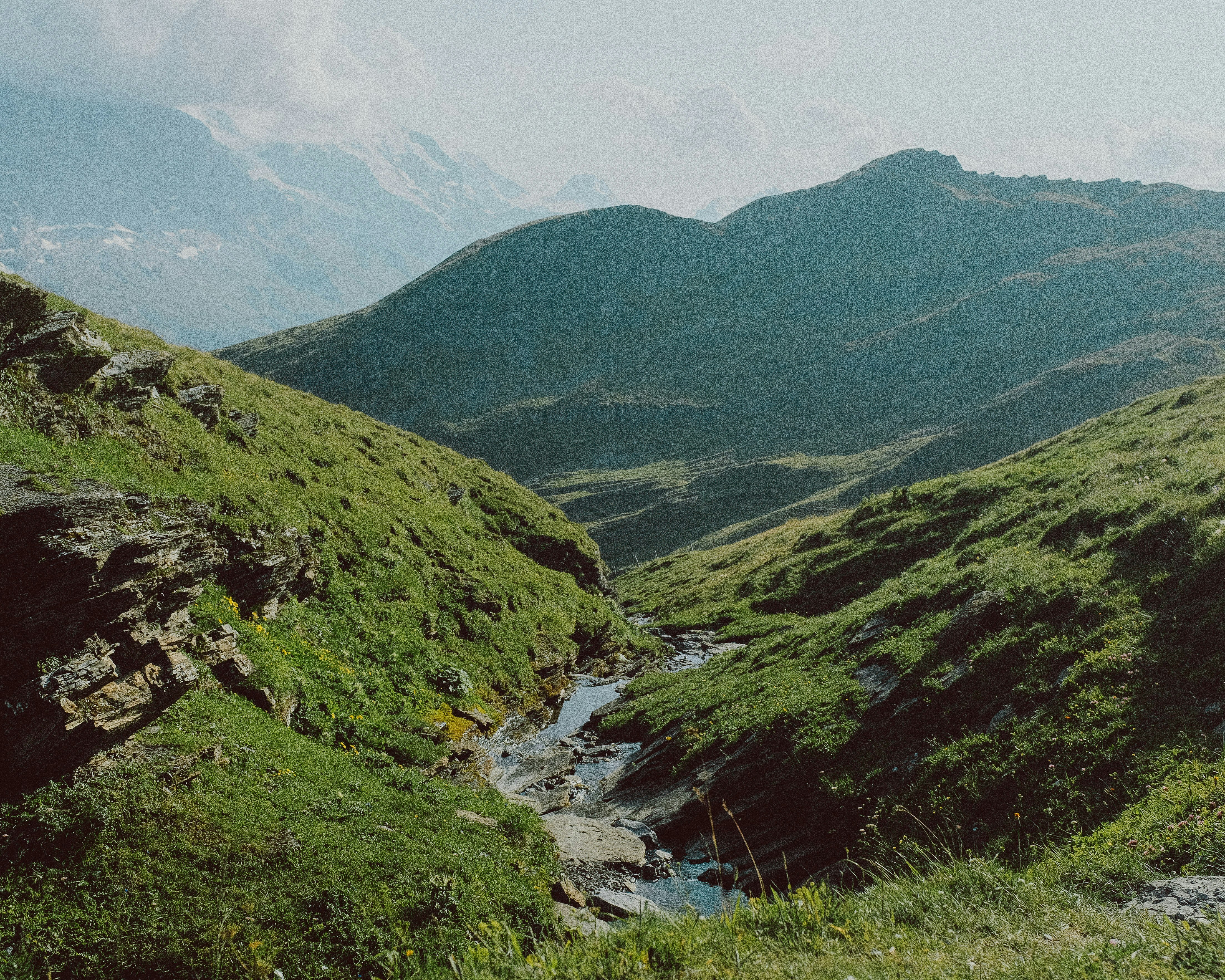 green mountains and river during daytime